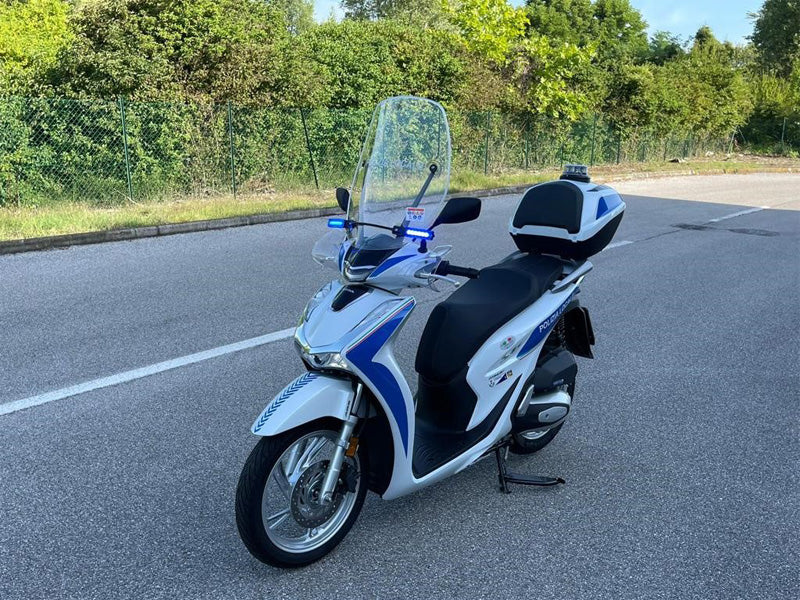 Police motorbike with blue lights and beacon
