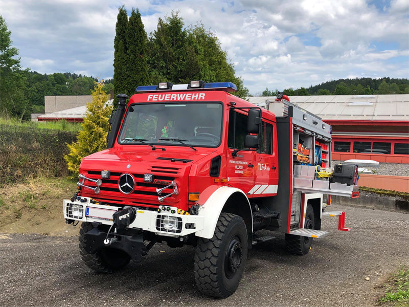 fire truck with blue lightbar featuring fitted headlights