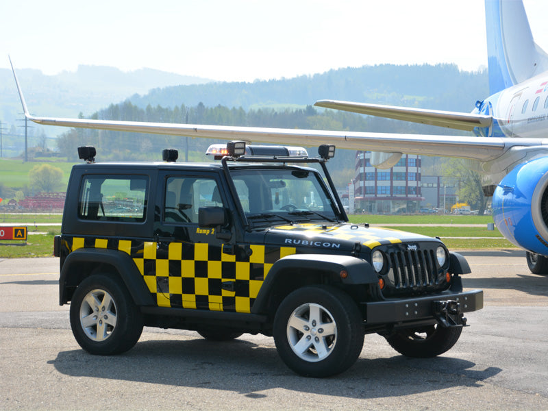 Airport Jeep with amber lightbar and work lights