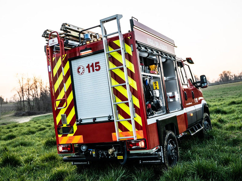 fire truck with blue high profile beacon and arrowbar