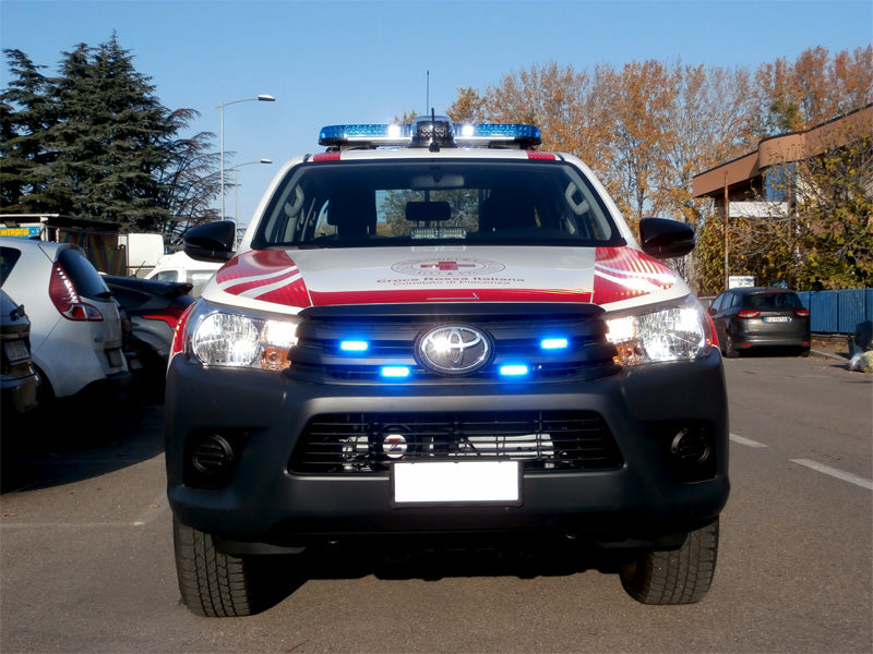 Red cross with blue lightbar and search light